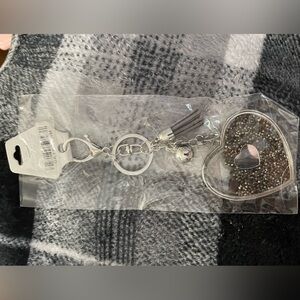 Beautiful keychain with sparkles and bling.  New in package never used.